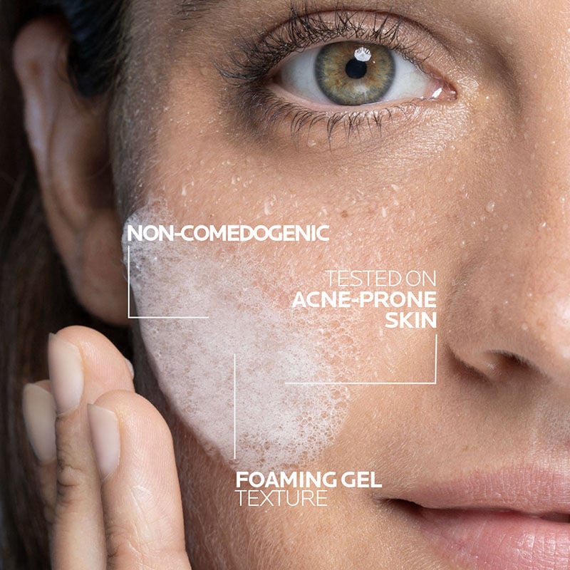 Woman applying Effaclar + M Purifying Foaming Gel Cleanser onto wet skin