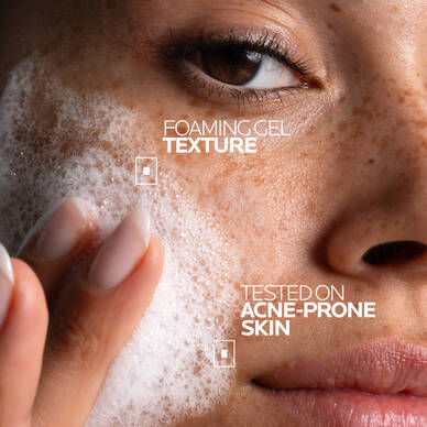 Woman applying Effaclar + M Purifying Foaming Gel Cleanser onto wet skin