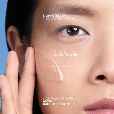 Person applying Effaclar Anti-Blemish Salicylic Acid Serum to face
