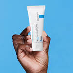 LA ROCHE POSAY CICAPLAST PRODUCT BEING HELD IN A HAND