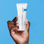 LA ROCHE POSAY CICAPLAST PRODUCT BEING HELD IN A HAND
