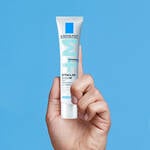 LA ROCHE POSAY ACNE PRONE PRODUCT BEING HELD IN A HAND