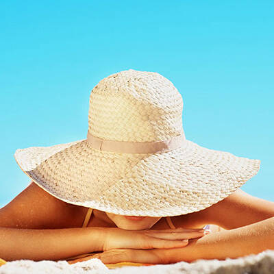 woman with rosacea in the sun