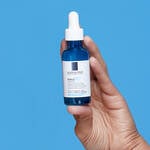 LA ROCHE POSAY HYLU B5 PRODUCT BEING HELD IN A HAND