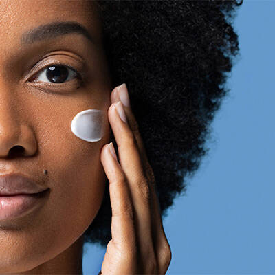 woman using hyaluronic acid skincare routine